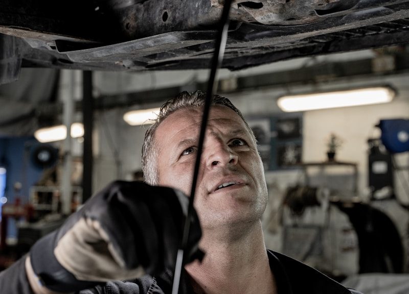 a man working on a car in a garage